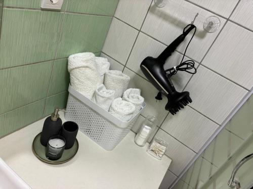 a black hair dryer sitting on a counter in a bathroom at Apartment S&S Tomislavgrad in Tomislavgrad