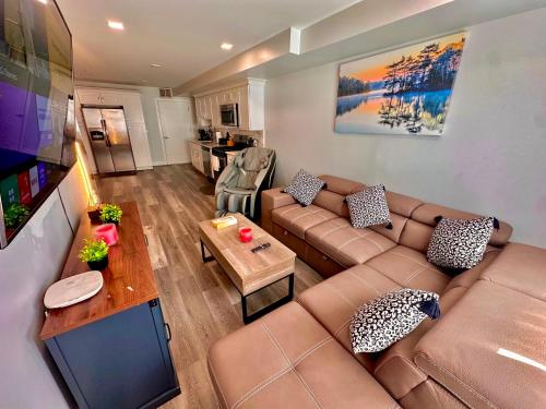 a living room with a couch and a table at The Classic Suite: 2BR close to NYC in Paterson