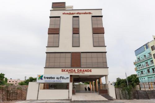 a building with a sign in front of it at Treebo Skanda Grande in Pondicherry
