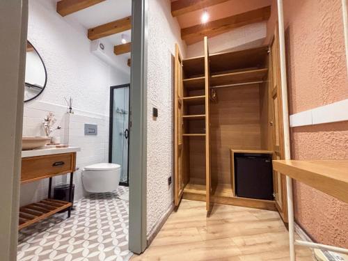 a bathroom with a toilet and a sink at Qara Otel in Ayvalık