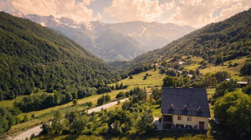 a house in the middle of a valley with mountains at Becho House in Becho