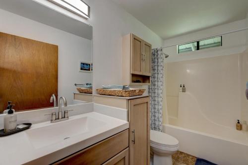 a bathroom with a sink and a toilet at Hale Ola Aina in Keaau