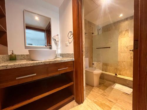 a bathroom with a sink and a toilet and a shower at Villa Arena Blanca in Punta Cana