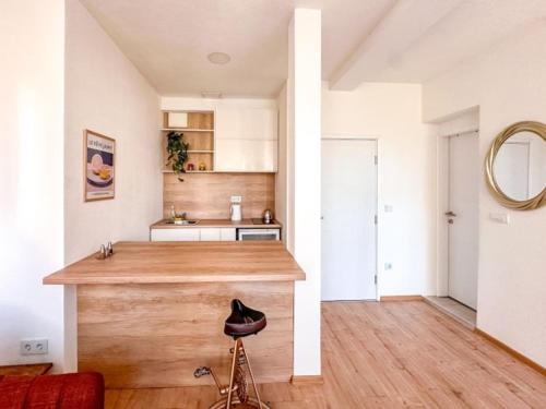 a kitchen with a wooden counter in a room at Andar's People in Sarajevo