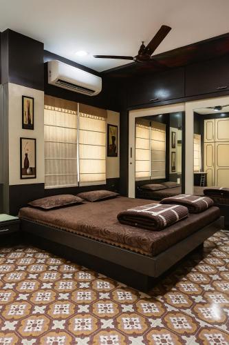 a bedroom with a large bed in a room at Luxurious Duplex Villa in Hyderabad