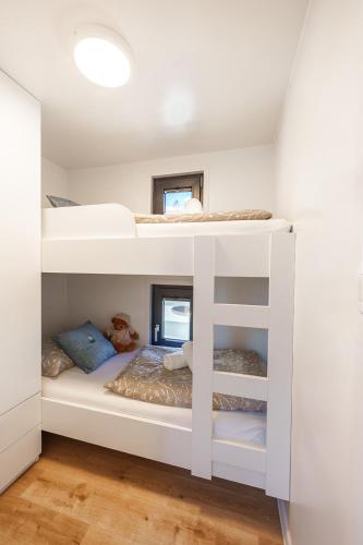 a bedroom with two bunk beds in a room at Pearl Infinity Luxury Floating House in Novigrad Istria