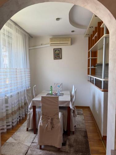 a dining room with a table and chairs at Dunav View Residence - River View Free Parking in Belgrade