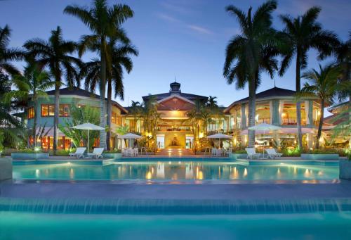 an exterior view of a resort with a swimming pool at Couples Negril in Negril