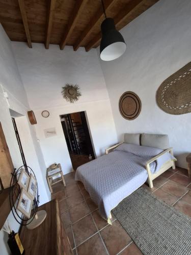 a bedroom with a bed in a room at Casa do Chico in Mértola