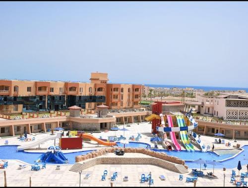 a large water park with a water slide at Nozha Beach للعائلات in Ras Sedr