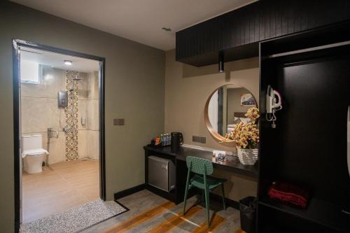 a bathroom with a sink and a shower at Hotel Valya Melaka Sentral Riverfront in Malacca
