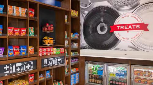 a store with a shelf of food and a cd at Hampton Inn Chelsea, Mi in Chelsea