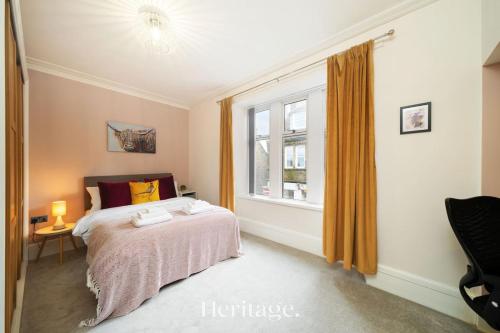 a bedroom with a bed and a window at The Copper Loft Apartment, Keith in Keith