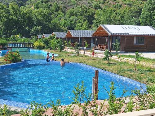 a group of children playing in a swimming pool at Ruby Bungalow Alanya in Yaylalı