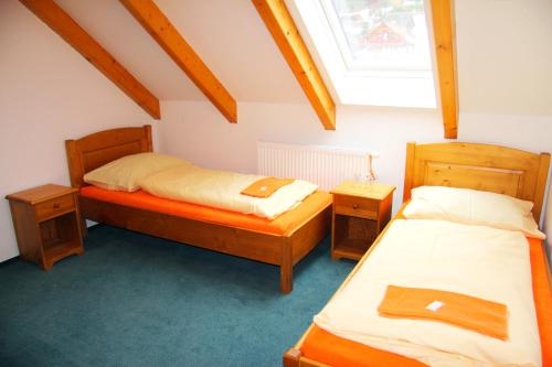 Ένα ή περισσότερα κρεβάτια σε δωμάτιο στο Pension Mandl