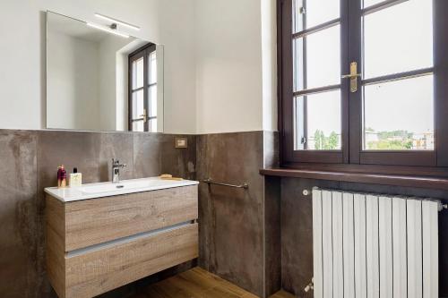a bathroom with a sink and a mirror at Katy Lake Timo in Sirmione
