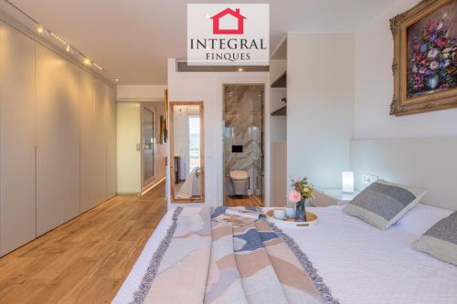 a bedroom with a bed and a sign that reads imperial things at La Braveta in Sant Antoni de Calonge