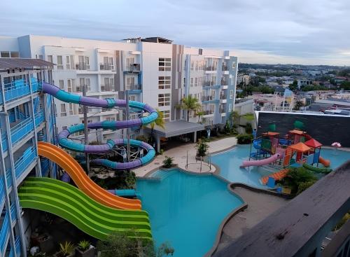 an aerial view of a water slide at a resort at Pentapolis Apartment Balikpapan Superblock LT4 in Balikpapan