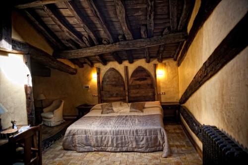 Postel nebo postele na pokoji v ubytování Hotel Palacio de Elorriaga