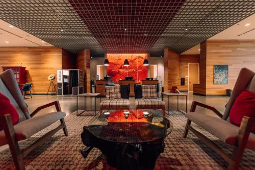 a lobby with couches and a table in a room at Hotel Indigo Denver Downtown - Union Station by IHG in Denver