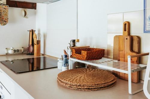 a kitchen with a counter with a shelf and a sink at Horta da Fonte in Alburitel