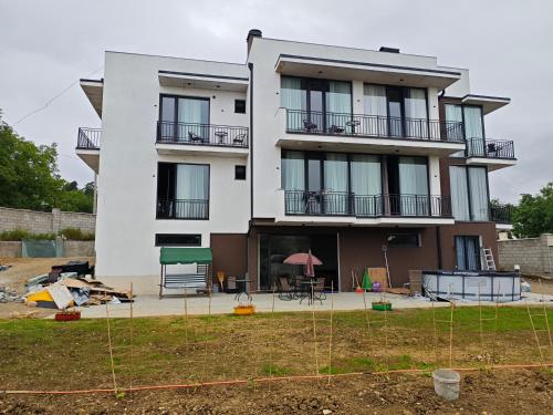 a building under construction with a yard at Hotel Manglisi Hills in Manglisi