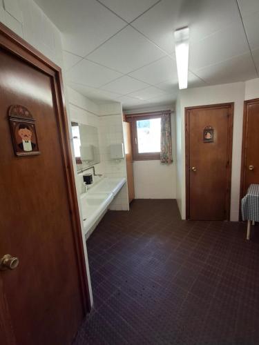a bathroom with a sink and a bath tub at Setcases-Vallter Hostal Mitja Pensió 5 in Setcases