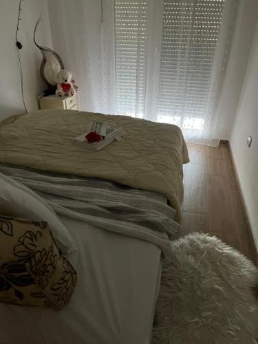 a bedroom with a bed and a rug at Stan na dan Ub in Ub