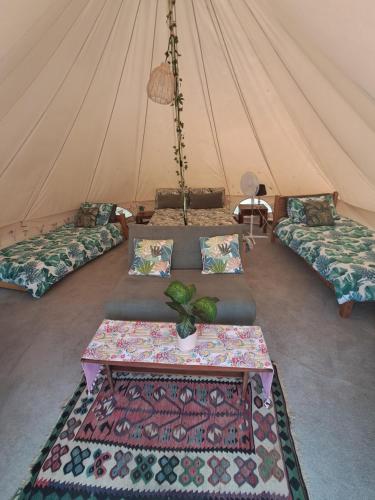 a room with three beds in a tent at The Old Waterworks - Saturn 6m bell tent in Clare