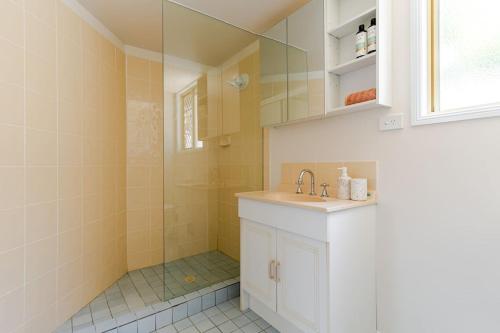 a bathroom with a sink and a shower at Margate Beach Studio 3 in Redcliffe