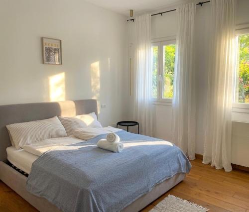 a bedroom with a bed with a stuffed animal on it at Poggio Madonna in Campagnatico