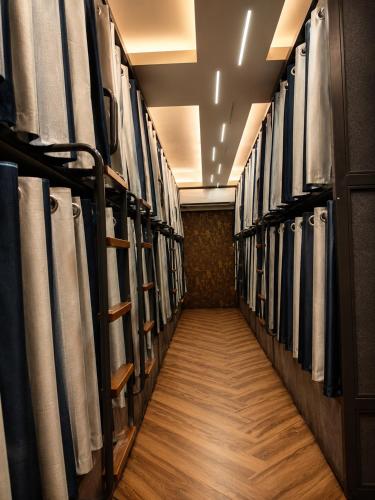 a row of racks in a locker room at Charyana Heights Ac Dormitory in Ahmedabad