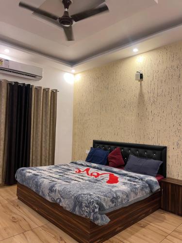a bedroom with a bed in a room at Moonshiva stay and cafe in Rishīkesh