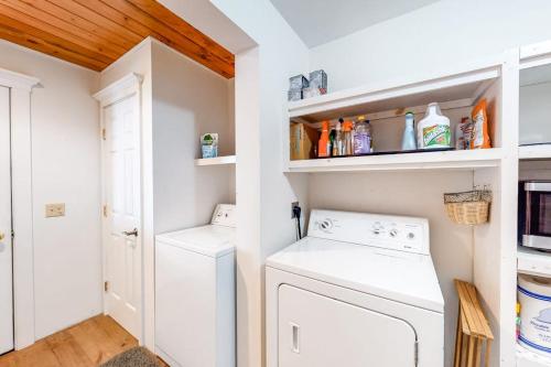 a laundry room with a washer and dryer at Dog-friendly, bayfront home w/rocky beach, full kitchen, washer/dryer & firepit in Gouldsboro