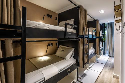 a group of bunk beds in a room at More Ipanema Hostel in Rio de Janeiro