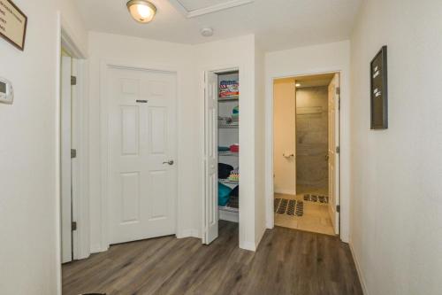 a hallway with a white door and a closet at Withlacoochee Trail Getaway - Private Pool - 3bedrooms in Inverness