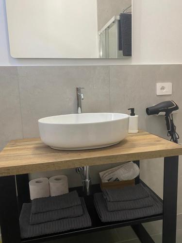 a white sink on a counter in a bathroom at Da Paola 