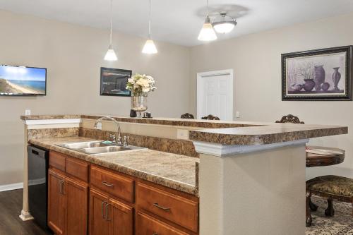 a kitchen with a sink and a counter at Mid-City Serenity Oasis in Huntsville
