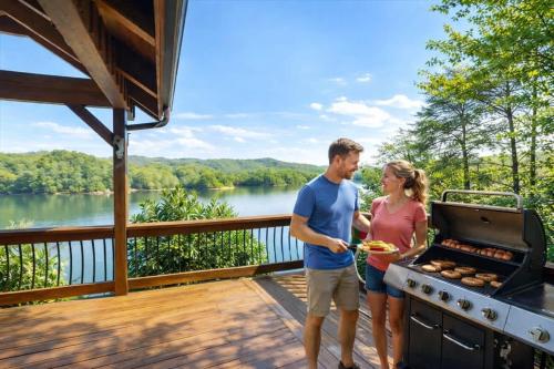 a man and woman cooking on a grill on a deck at Ultimate Lake Norris Getaway with Private Dock in New Tazewell