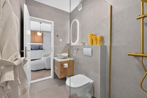a bathroom with a toilet and a sink in it at B&B Villa Dubrovnik Garden in Dubrovnik