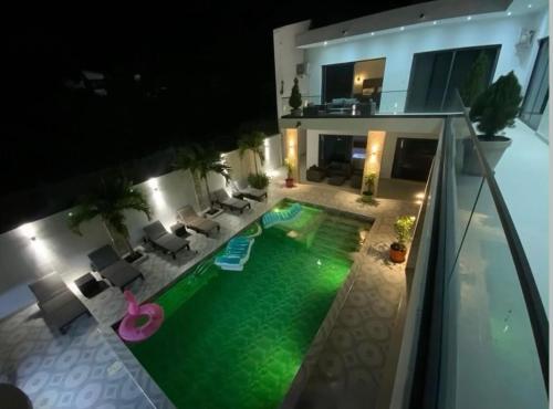 an aerial view of a house with a swimming pool at m hadji premium in Dakar