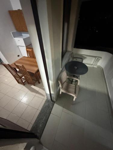a view of a room with a table and chairs at ApartHotel Fahria Velipoje in Velipojë