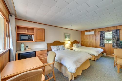 a hotel room with two beds and a table at Lake Champlain Studio: Fish, Play & Relax in Willsboro