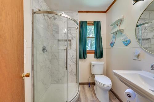 a bathroom with a shower and a toilet and a sink at Lake Champlain Studio: Fish, Play & Relax in Willsboro