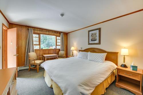 a bedroom with a large bed and a desk at Lake Champlain Waterside Retreat w/ Dock Access in Willsboro