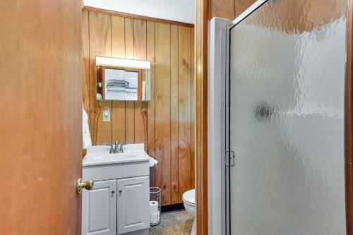 a bathroom with a sink and a mirror and a shower at Lake Champlain Waterside Retreat w/ Dock Access in Willsboro