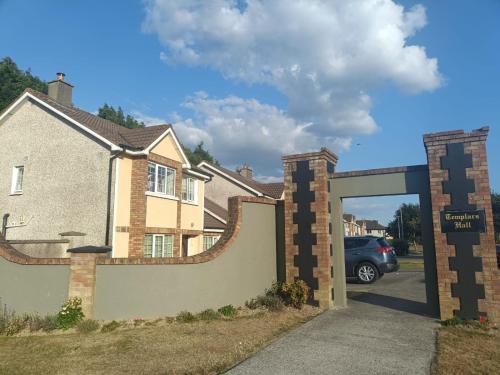 a garage entrance to a house with a car parked at Ideal Guest Home in Waterford