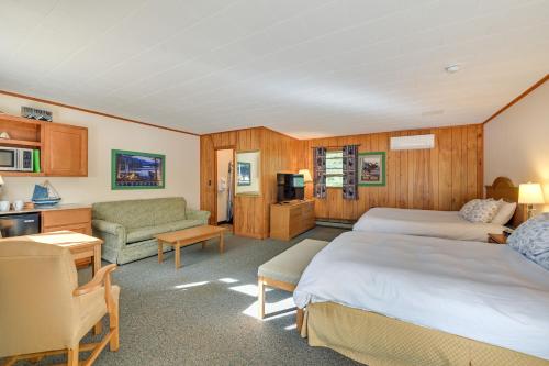 a hotel room with two beds and a living room at Lake Champlain On-Site! Waterfront Studio w/ Dock in Willsboro