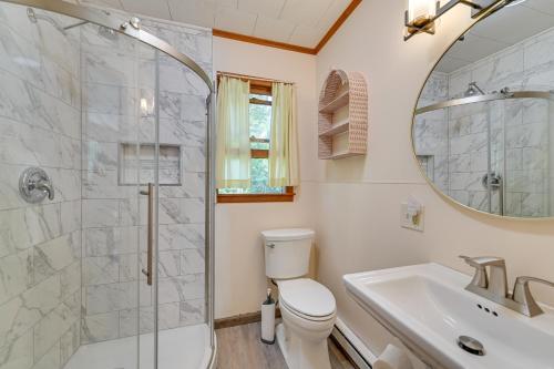 a bathroom with a shower and a toilet and a sink at Lake Champlain Retreat w/ Dock, Games & More in Willsboro