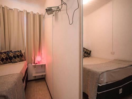 Giường trong phòng chung tại Apartamento Rua das Pedras Búzios